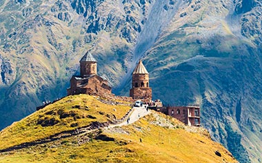 Gergeti Sameba Church overlooked by Mount Kazbek in Georgia 